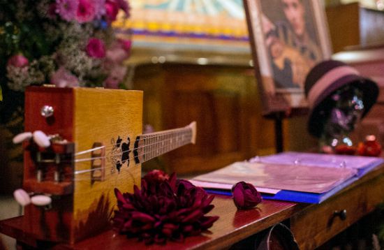 An instrument and song book are displayed at the funeral of Jillian Johnson in Lafayette, Louisiana. (Paul Kieu/The Daily Advertiser/AP)